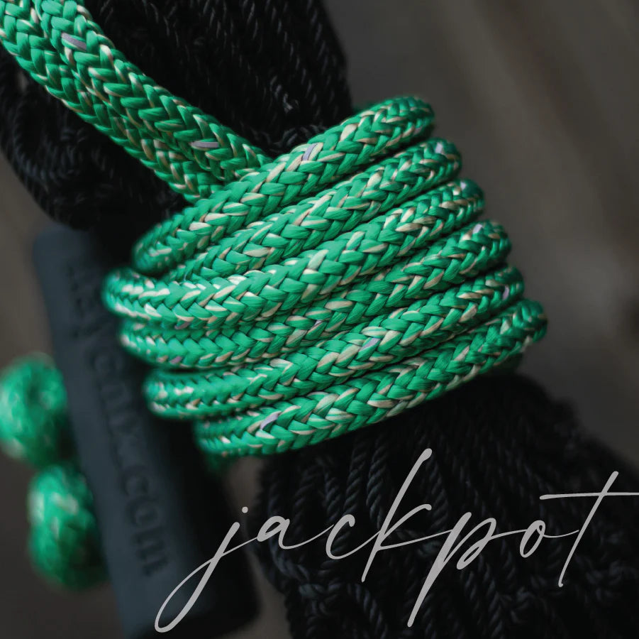 Hay Chix hay net with Jackpot-colored braided rope, featuring vibrant green and tan tones, highlighting the rope's texture and the black toggle closure.